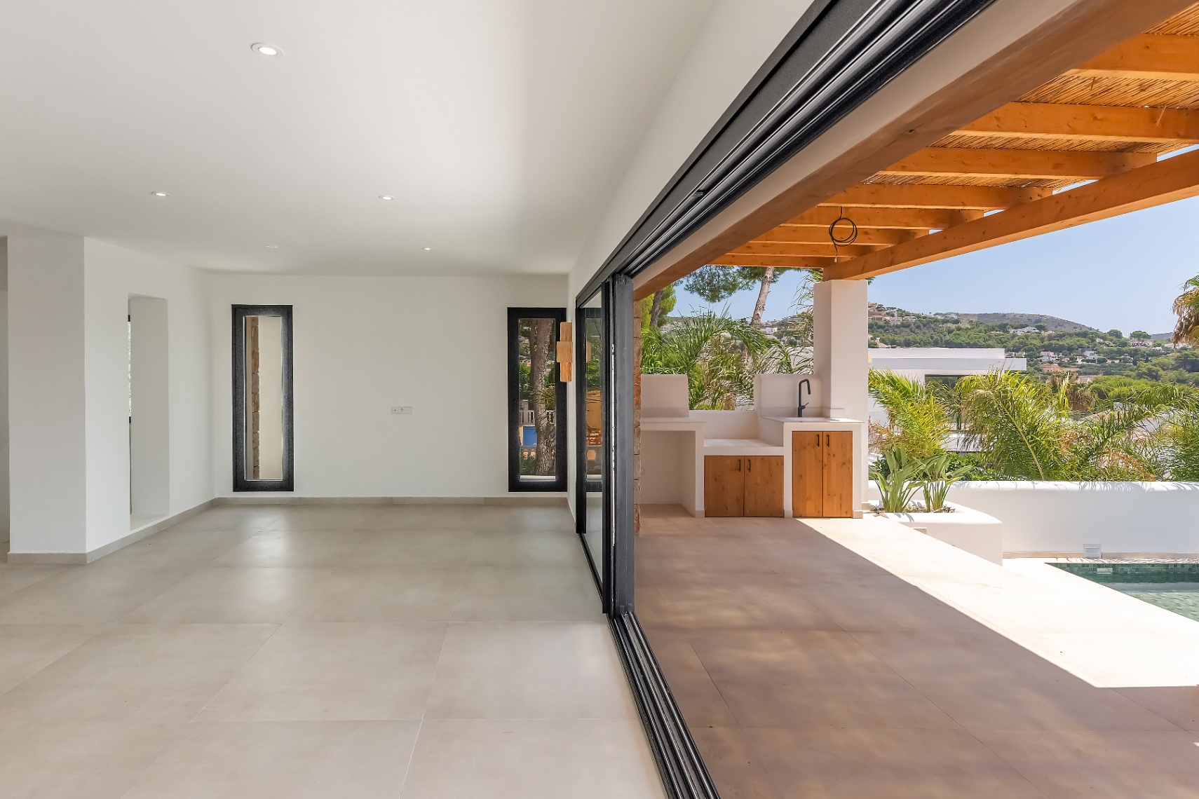 12680NS - Luxury Ibiza-Style Villa for Sale in Moraira with Panoramic Sea Views
