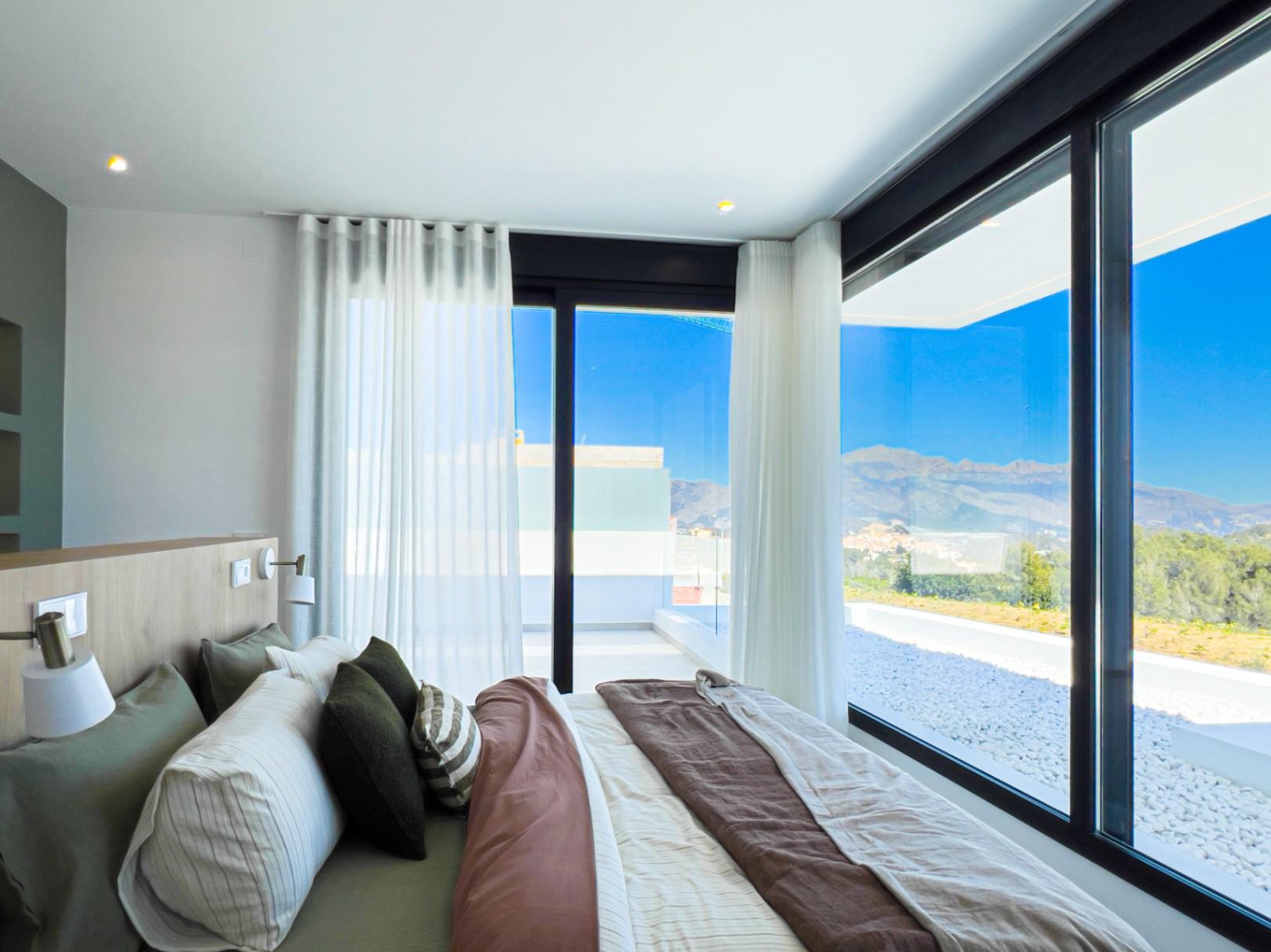 1233DA - Nouvelle villa contemporaine avec piscine à débordement à Polop – première de 46 achevées