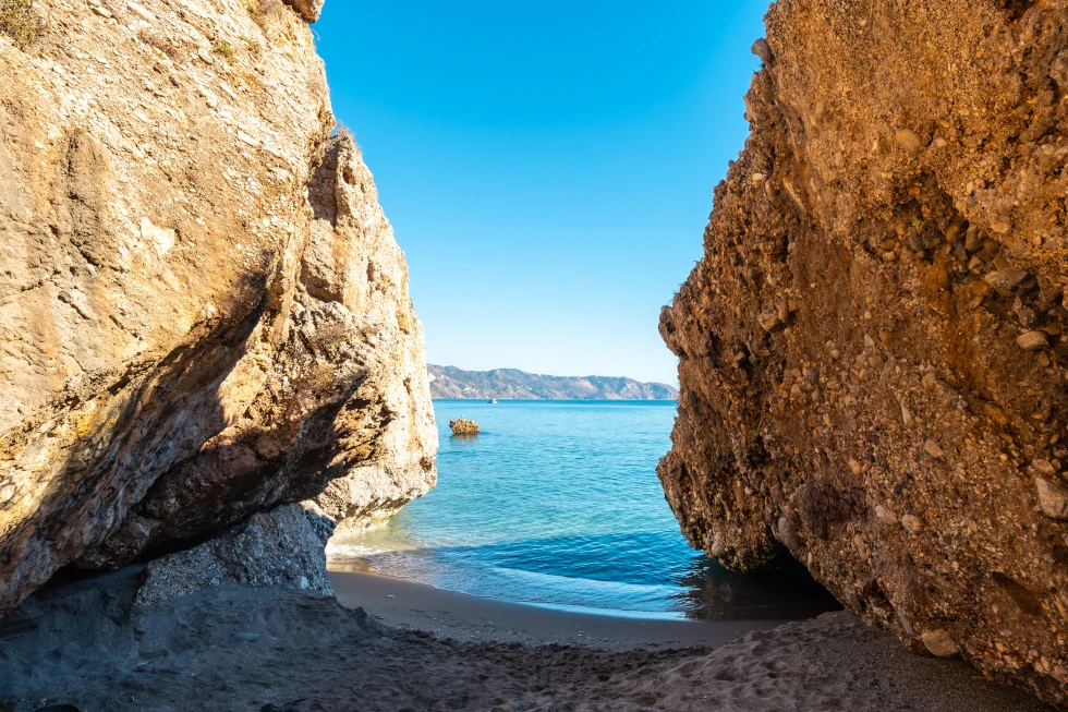 Detail of the sea in the small coves on Calahonda beach in the town of Nerja, Andalucia. Spain. Costa del sol in the mediterranean sea